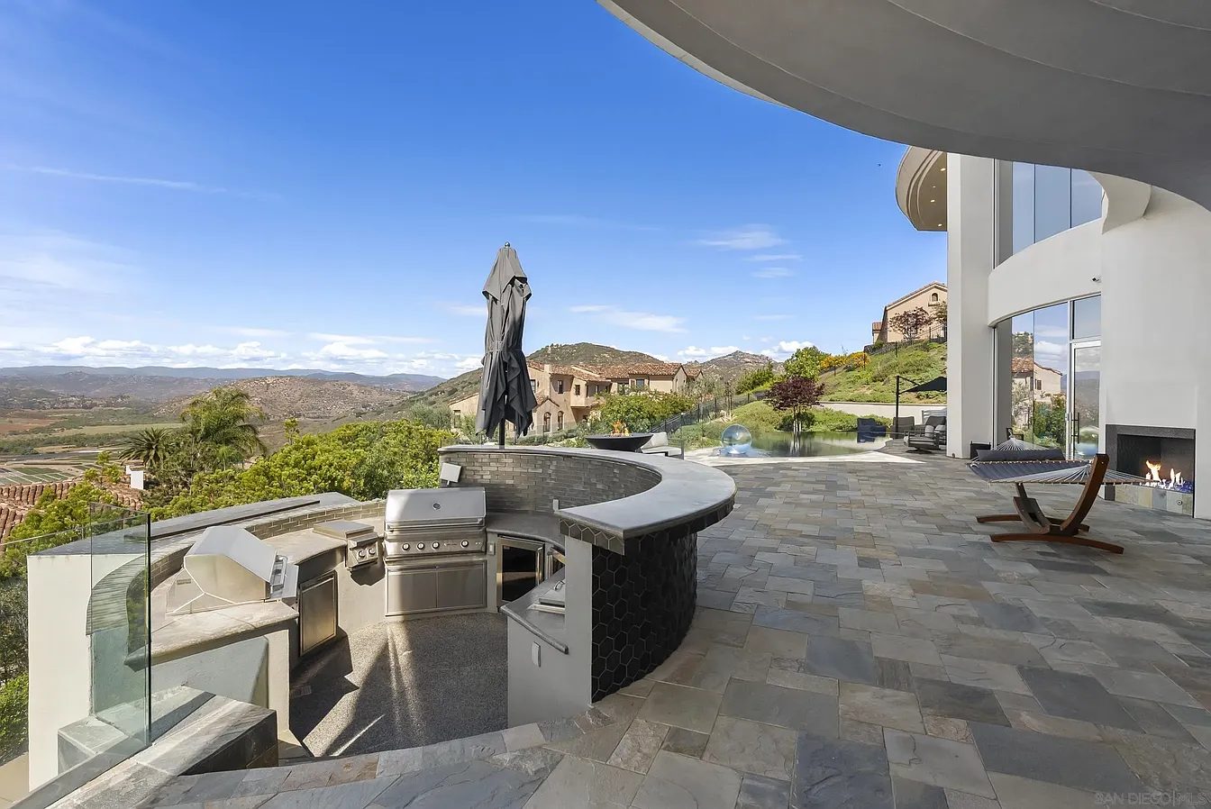 Outdoor kitchen and living space by Panjia Outdoors in North County San Diego